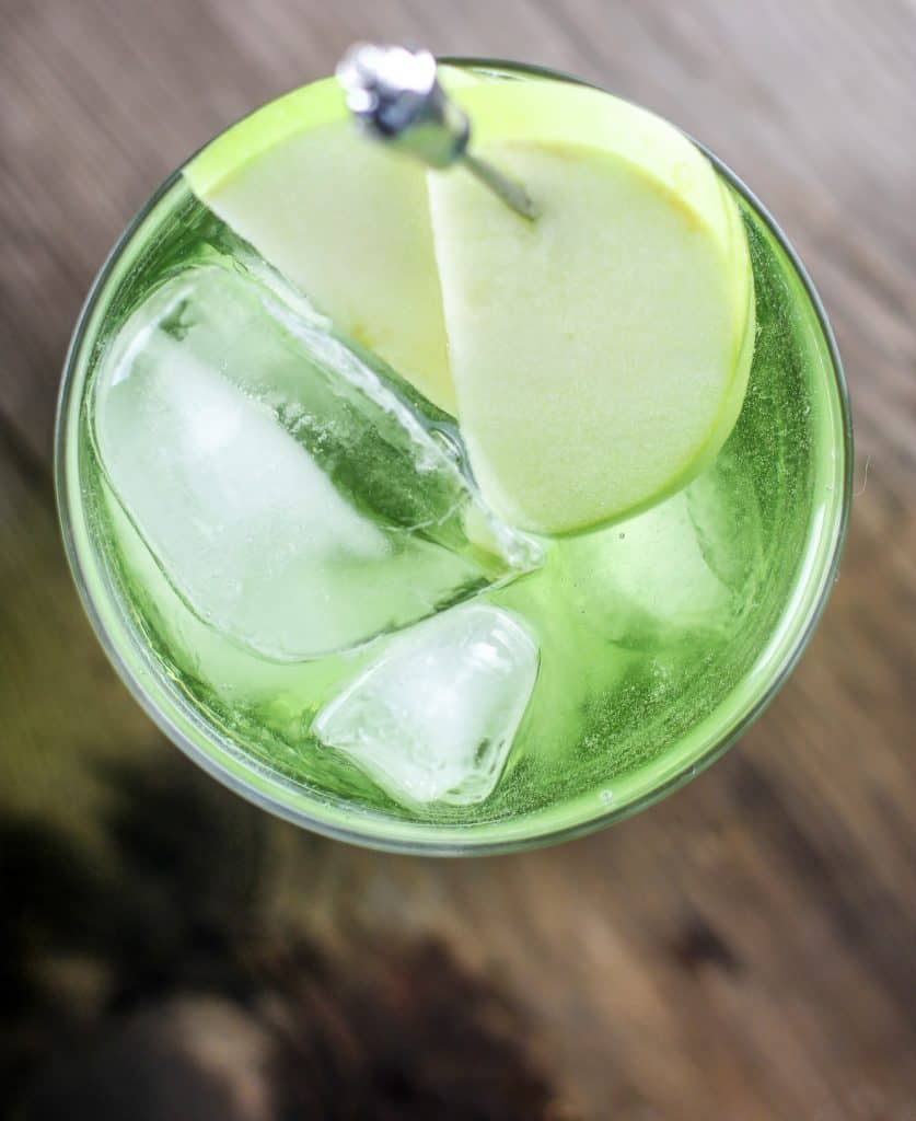 Irish Sour Apple Cocktail with a green apple garnish