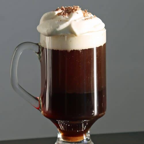 The Perfect Irish Coffee Recipe. Here is a traditional Irish Coffee Cocktail with Jameson we got while visiting Ireland. It is easy to make with how to make recipe and a bit of Irish love. #irishcoffee #recipe #jameson #howtomake