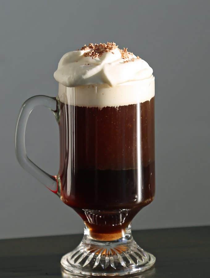 The Perfect Irish Coffee Recipe. Here is a traditional Irish Coffee Cocktail with Jameson we got while visiting Ireland. It is easy to make with how to make recipe and a bit of Irish love. #irishcoffee #recipe #jameson #howtomake