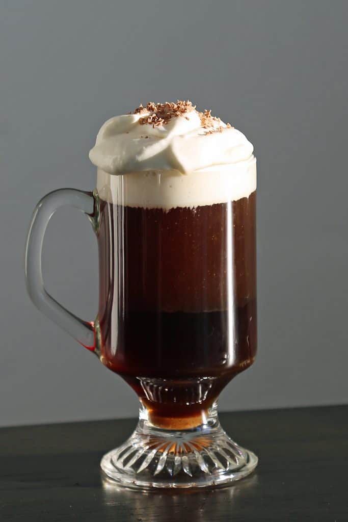 The Perfect Irish Coffee Recipe. Here is a traditional Irish Coffee Cocktail with Jameson we got while visiting Ireland. It is easy to make with how to make recipe and a bit of Irish love. #irishcoffee #recipe #jameson #howtomake