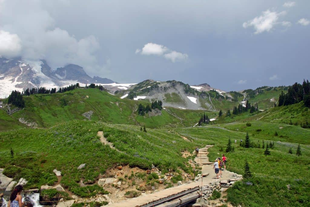 things to do at Mount Rainier National Park in Washington. This park is close to Seattle and makes a great bucket list road trip destination for those living in the Pacific Northwest. Activities include Hiking, visiting Reflection Lakes, Visit the Historic Paradise and Longmire Areas, lodging and camping. 