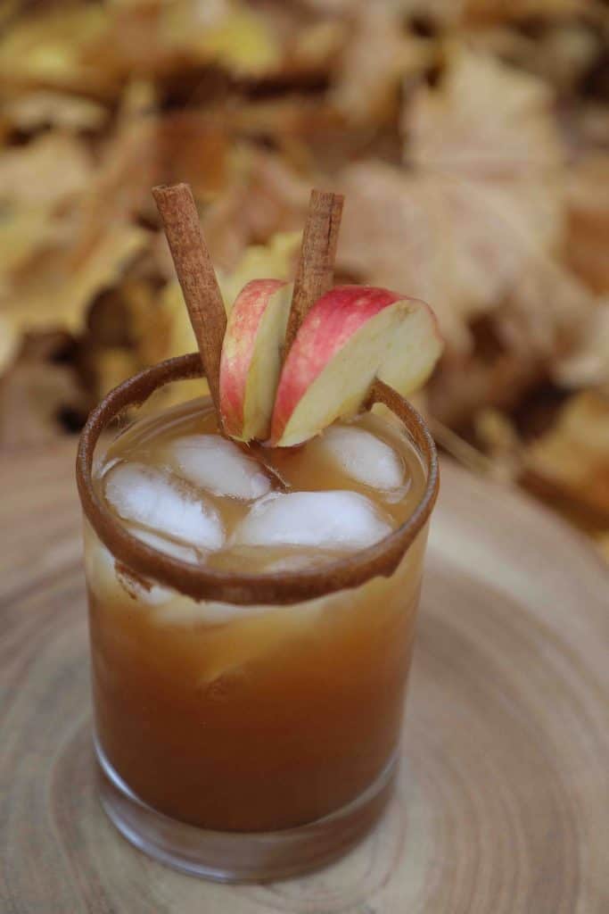 This Spiced Apple Pie Cocktail has all the classic fall drinks flavors everyone loves including apple, caramel, and cinnamon. It's like fall in a glass! 