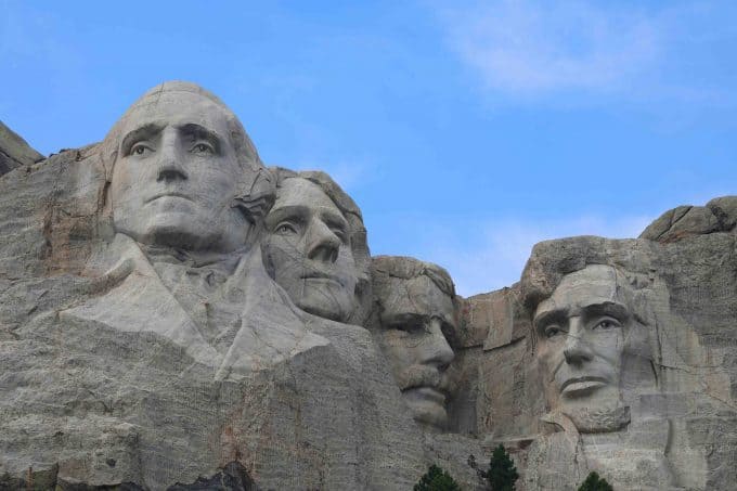 Close up photos of the four presidents carved in Mount Rushmore 