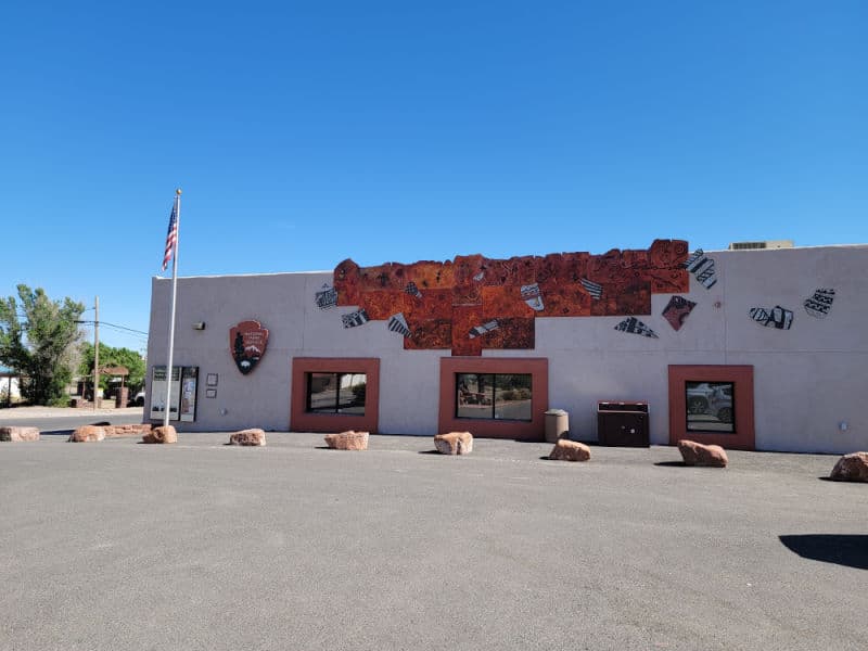 Exterior of the visitor center with the National Park Service emblem at Salinas Pueblo Missions National Monument, New Mexico