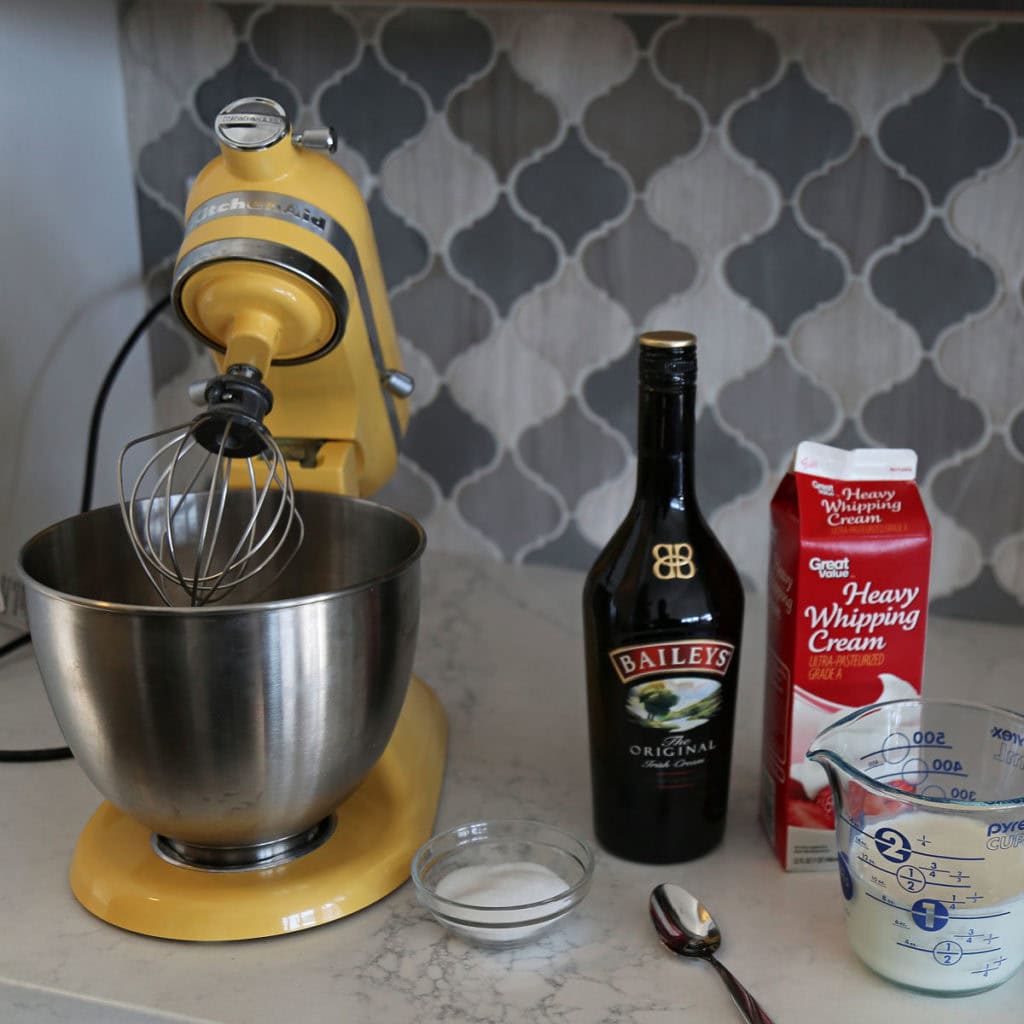 Stand mixer with Bailey's and Heavy whipping cream to make whipped cream on top of drink