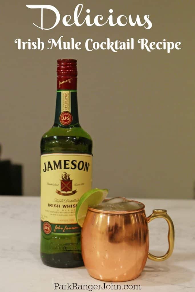 Irish Mule Cocktail Recipe over a bottle of Jameson Whiskey and Copper Mule mug with cocktail in it