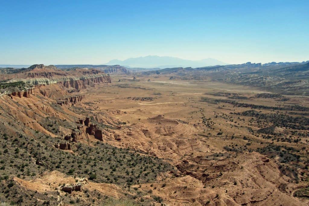 Travel Guide for exploring Cathedral Valley in Capitol Reef National Park in Utah. This guide will help you prepare for one of the National Parks epic road trips #cathedralvalley #capitolreef #nationalpark #utah