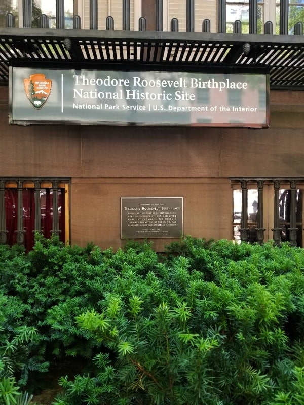 Theodore Roosevelt Birthplace National Historic Site entrance sign and historical marker 