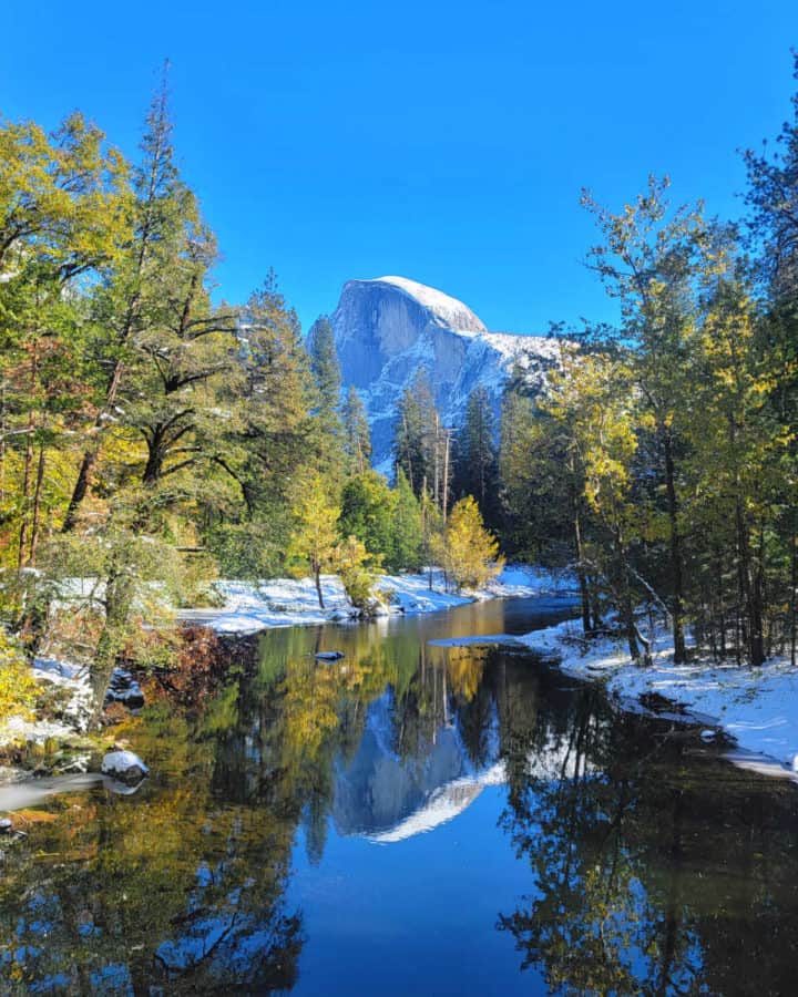 Half Dome and Merced River with snow at Yosemite National Park in the Winter