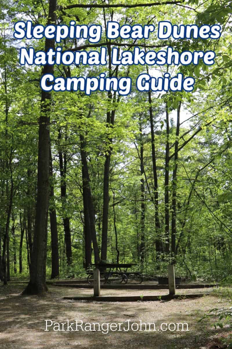 Text reading "Sleeping Bear Dunes National Lakeshore Camping Guide by ParkRangerJohn.com" with a photo of a campsite at Platte River Campground in Sleeping Bear Dunes National Lakeshore