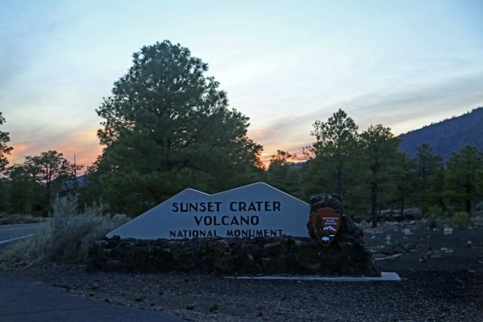 Sunset Crater Volcano National Monument entrance sign at sunset 