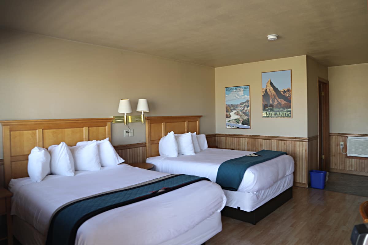two queen beds in the Badlands Inn room located on the second floor