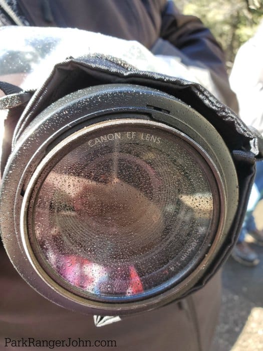 front of camera lens covered in mist by the waterfall