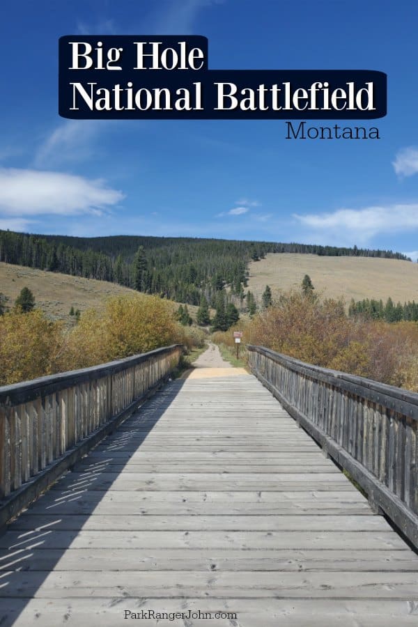 Big Hole National Battlefield text over a bridge leading to grassy hills