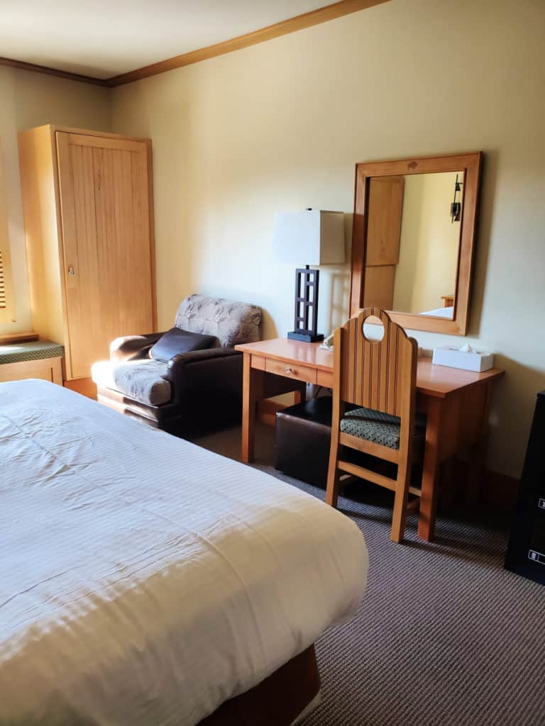 Chair and desk in room at Old Faithful Snow Lodge
