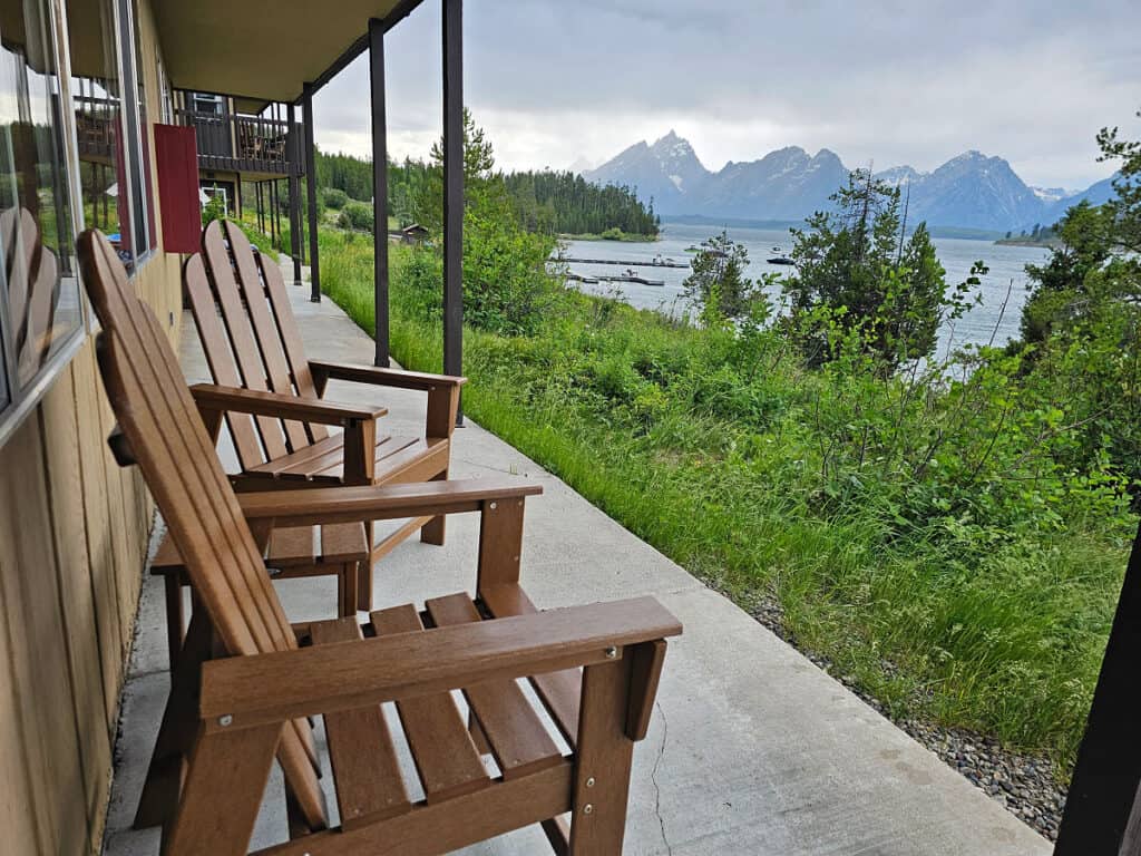 Chairs on deck of room at Signal Mountain Lodge with view of the Tetons