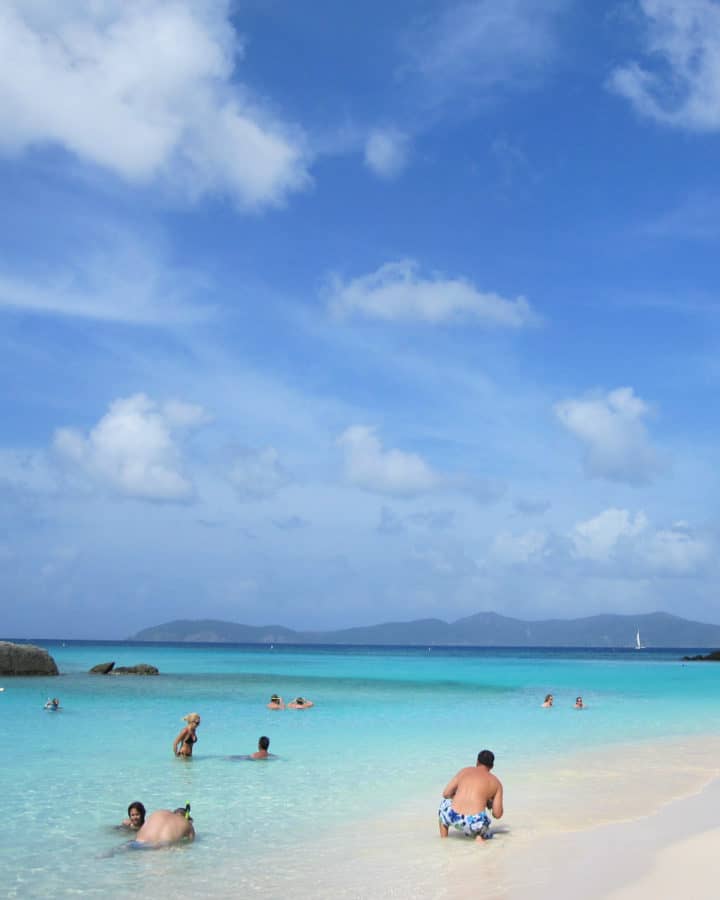 Visitors enjoying the water at St John's Trunk Bay in Virgin Islands National Park