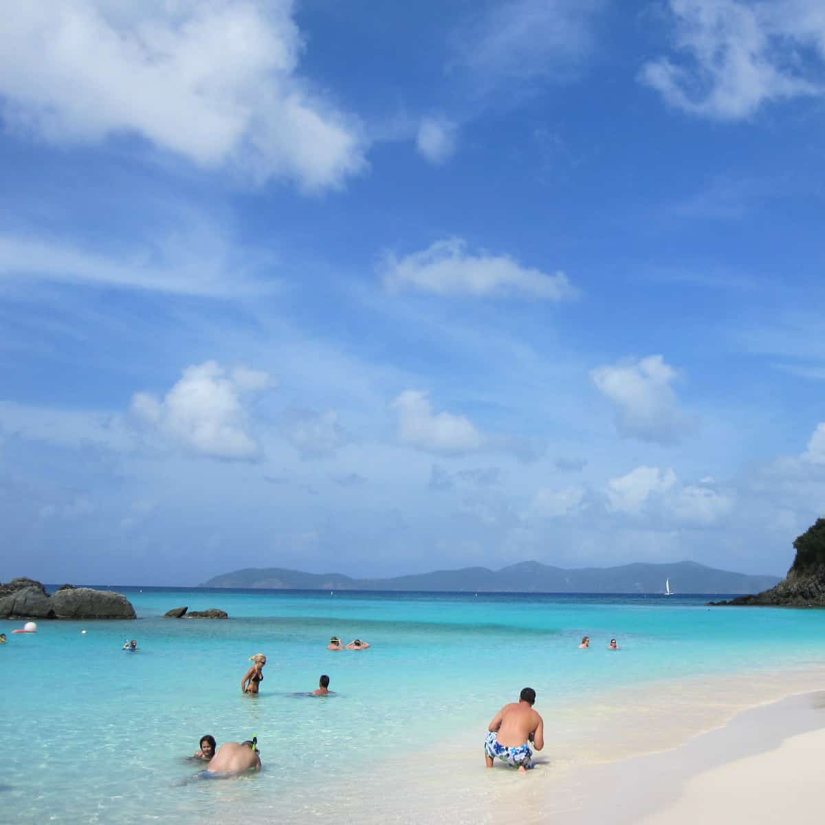 Visitors enjoying the water at St John's Trunk Bay in Virgin Islands National Park