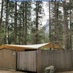 Photo of cabin in Housekeeping Camp with text reading "Housekeeping Camp Yosemite National Park by ParkRangerJohn.com"