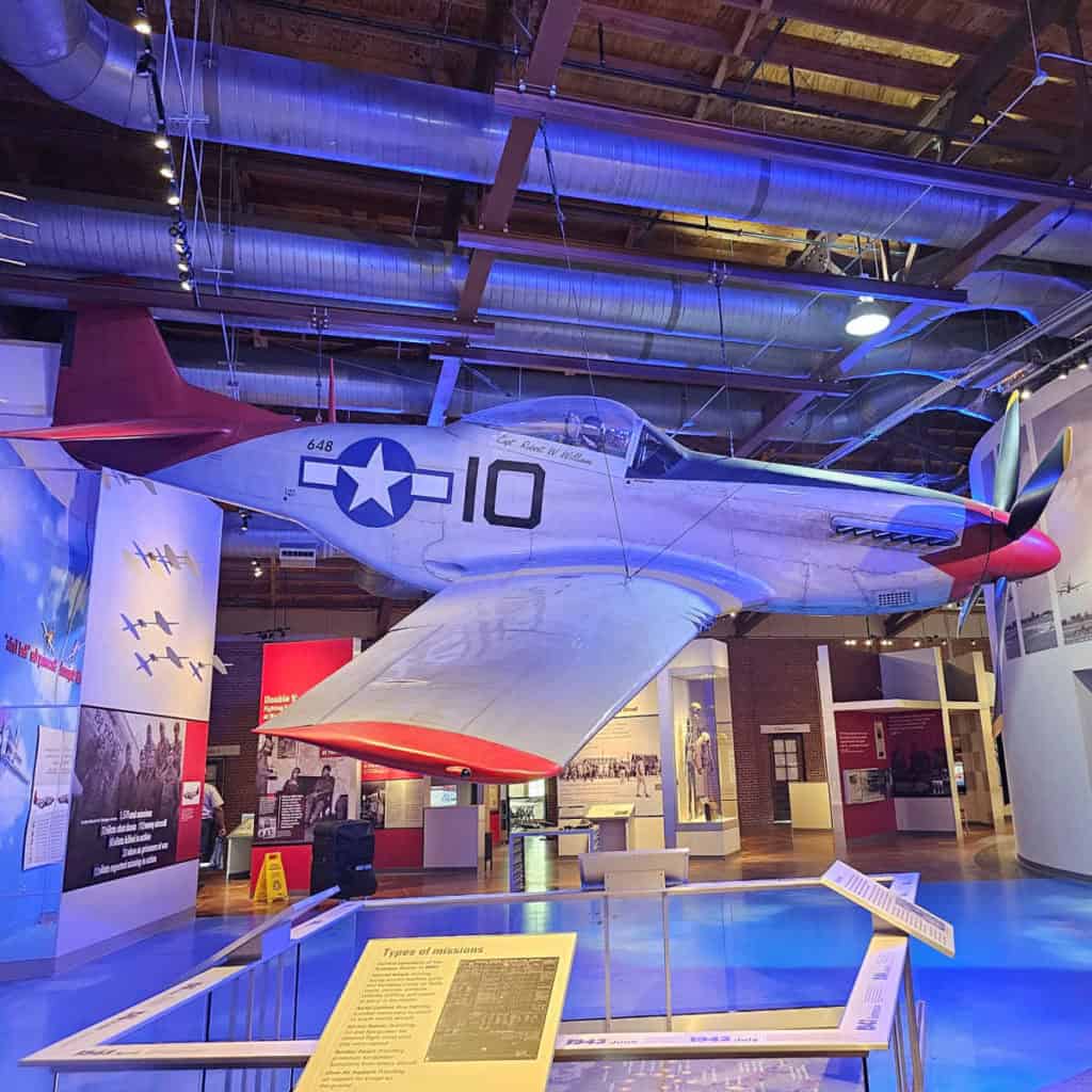 P-51 Mustang airplane hanging from the ceiling in Tuskegee Airmen National Historic Site commemorating the first African American military pilots in the U.S. Army Air Corps.