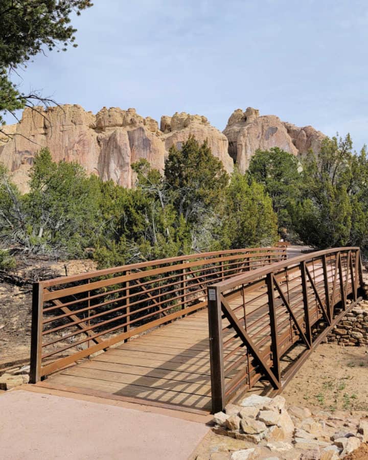 crossing a bridge while hiking the Inscription Rock Trail Loop at El Morro National Monument in New Mexico