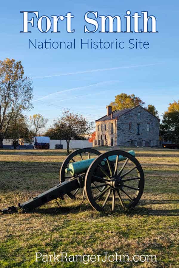 Fort Smith National Historic Site text printed above a canon and historic buildings