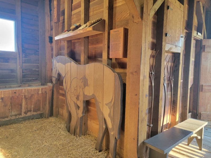 Historic Stable display wooden horses at Fort Scott NHS
