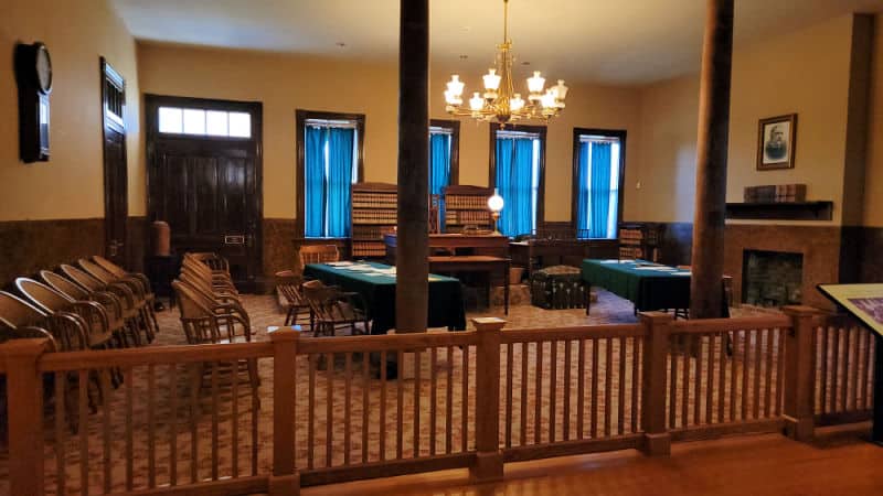 Historic Judges chambers behind a wooden gate in Fort Smith NHS Visitor Center
