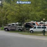 Text "Gulpha Gorge Campground Hot Springs National Park Arkansas by ParkRangerJohn.com" with several campsites filled with campers