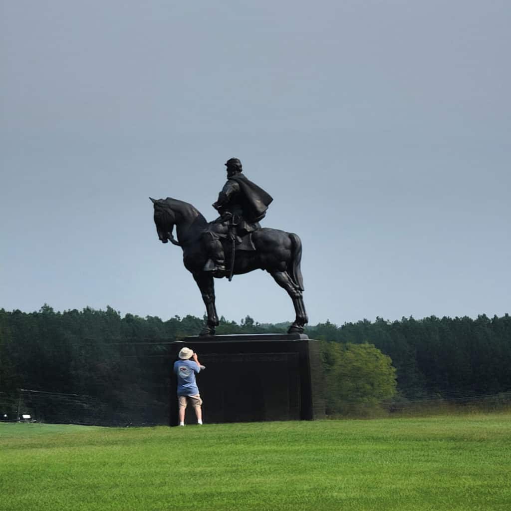 Park Visitor Photographing a statue at Manassas National Battlefield