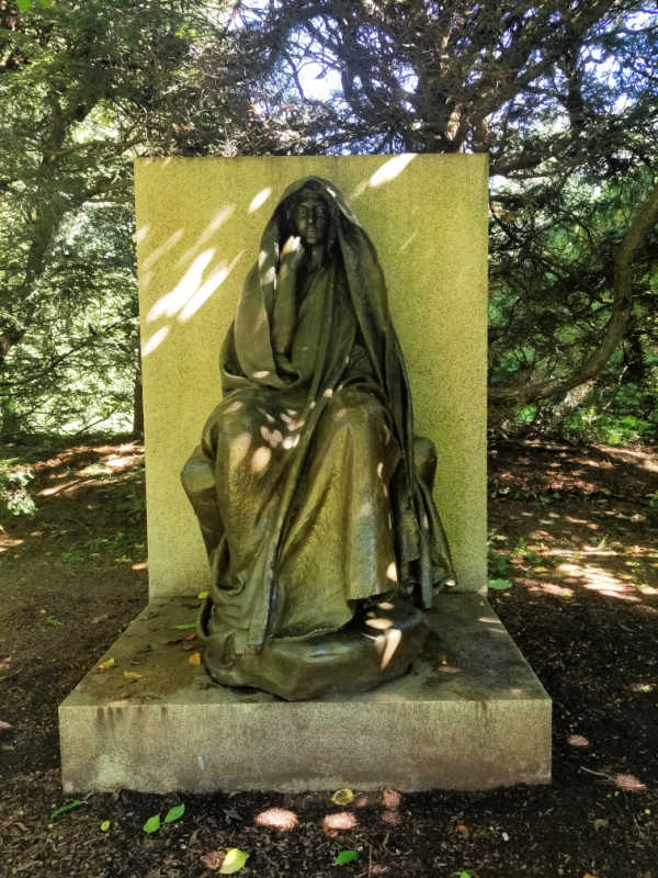 Adams memorial covered by tree shadows in Saint Gaudens National Historical Park, New Hampshire