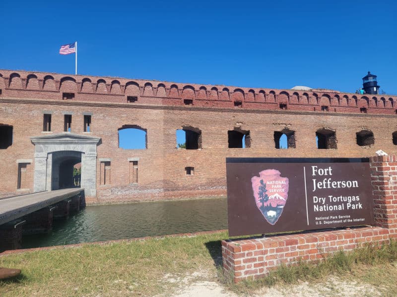 Fort Jefferson Entrance Sign and view of the moat in Dry Tortugas National Park, Florida
