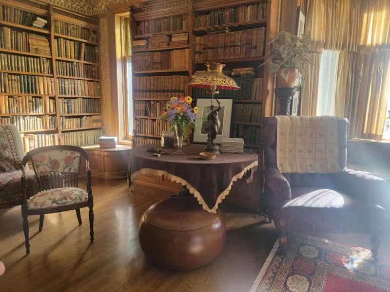 historic library with table and chairs in the Wilcox House, Theodore Roosevelt Inaugural Site National Historic Site, New York