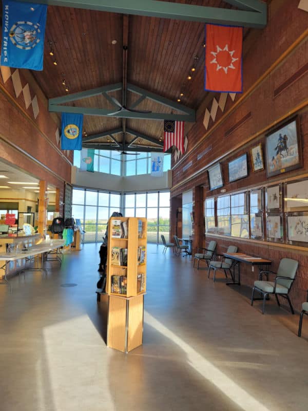 interior of the visitor center with flags hanging from the ceiling at Washita Battlefield NHS