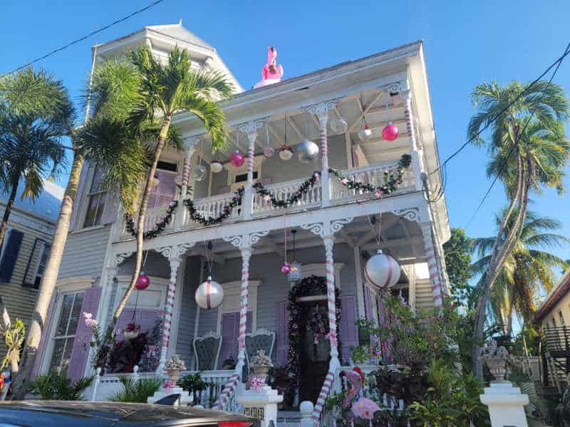 Key West historic house decorated for Christmas with Flamingos and garland