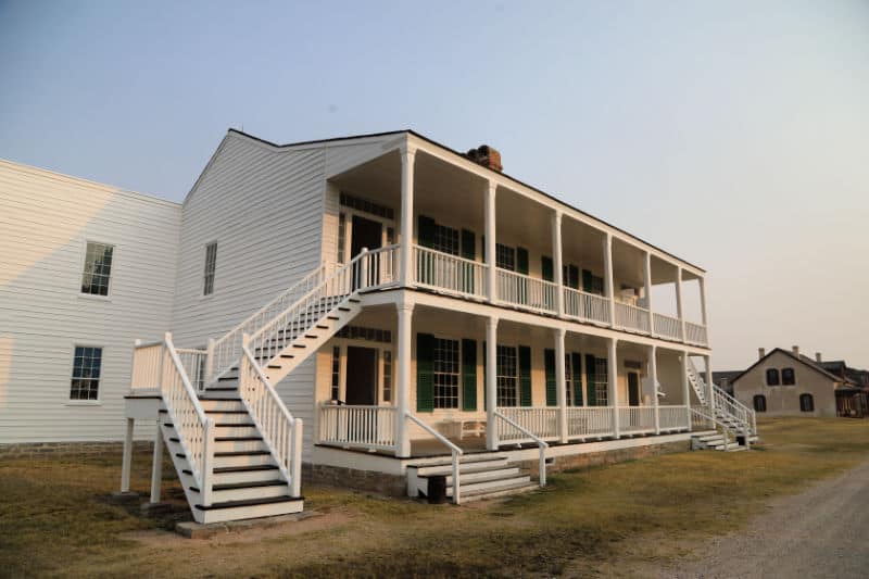 Historic Old Bedlam two story building with exterior white stairs in Fort Laramie NHS