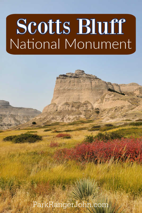 Scotts Bluff National Monument text written above Scotts Bluff with fall grasses