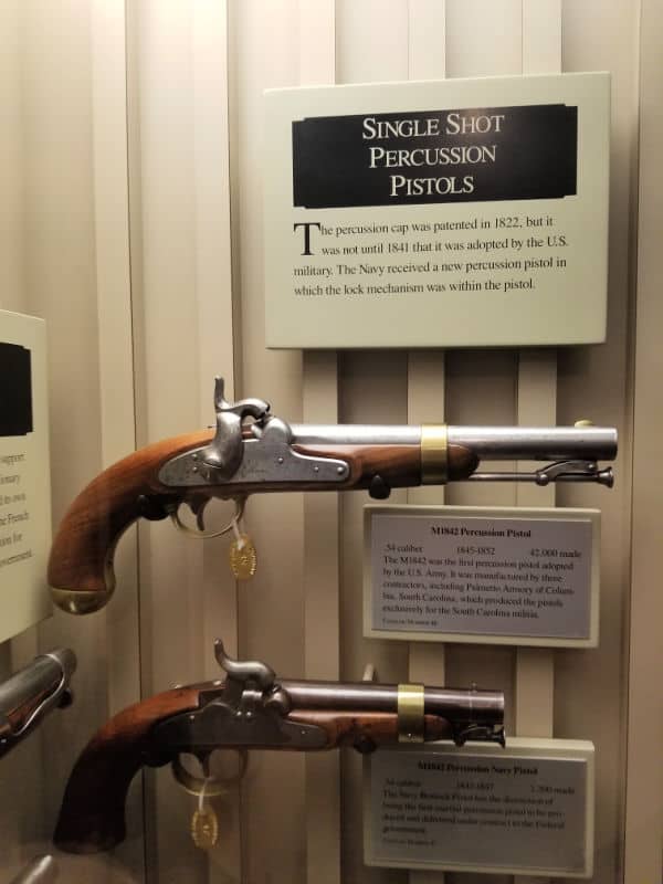 2 Single Shot Percussion Pistols in a display case at Springfield Armory NHS