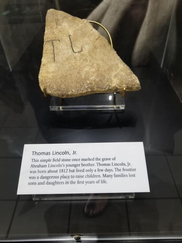 T L engraved on a stone to mark Thomas Lincoln Jr Grave at the visitor center of Abraham Lincoln Birthplace National Historical Park, Kentucky