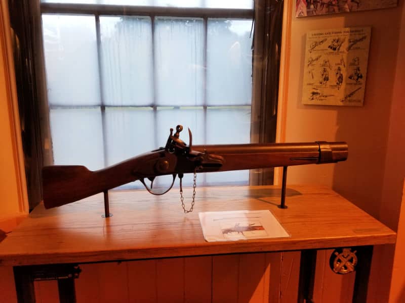 Flintlock Musket on display near a window at Springfield Armory National Historic Site