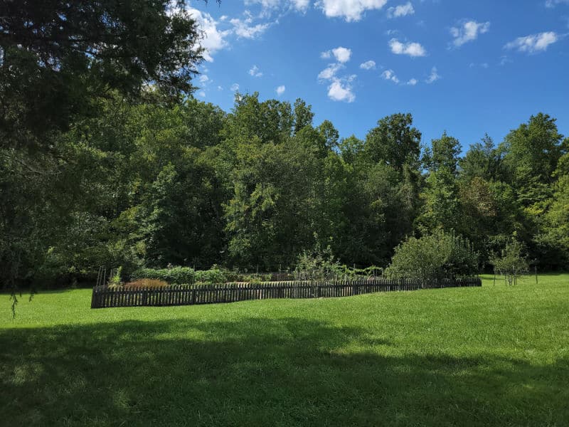 Gardens with a fence around them in Booker T Washington National Monument