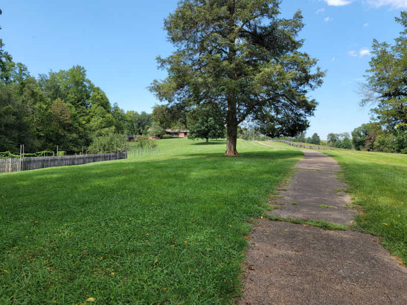 paved trail up a hill to the visitor center at booker t washington national monument