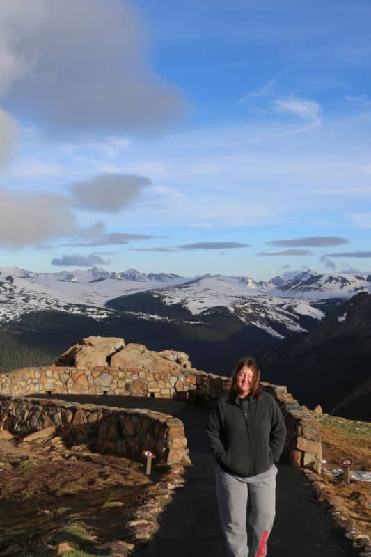 Women walking on paved trail with Rocky Mountains in the background