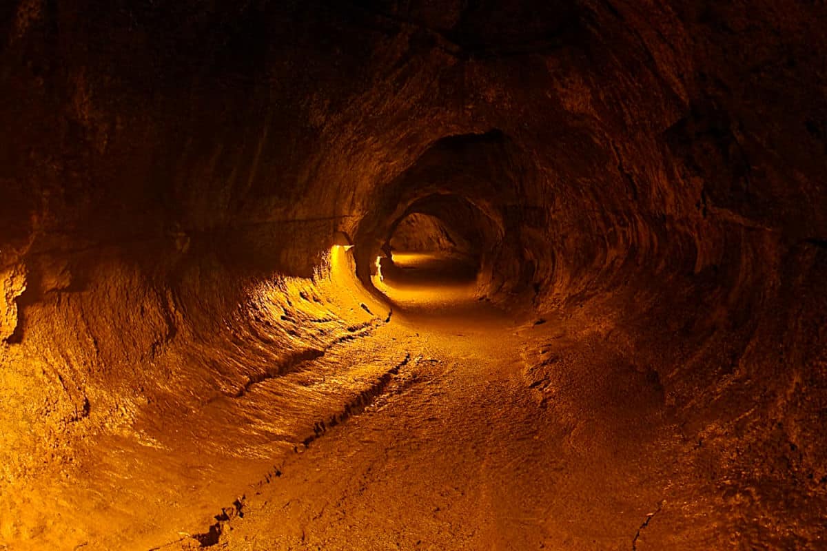 Inside Nahuku Thurston Lava Tubes lit by lights 