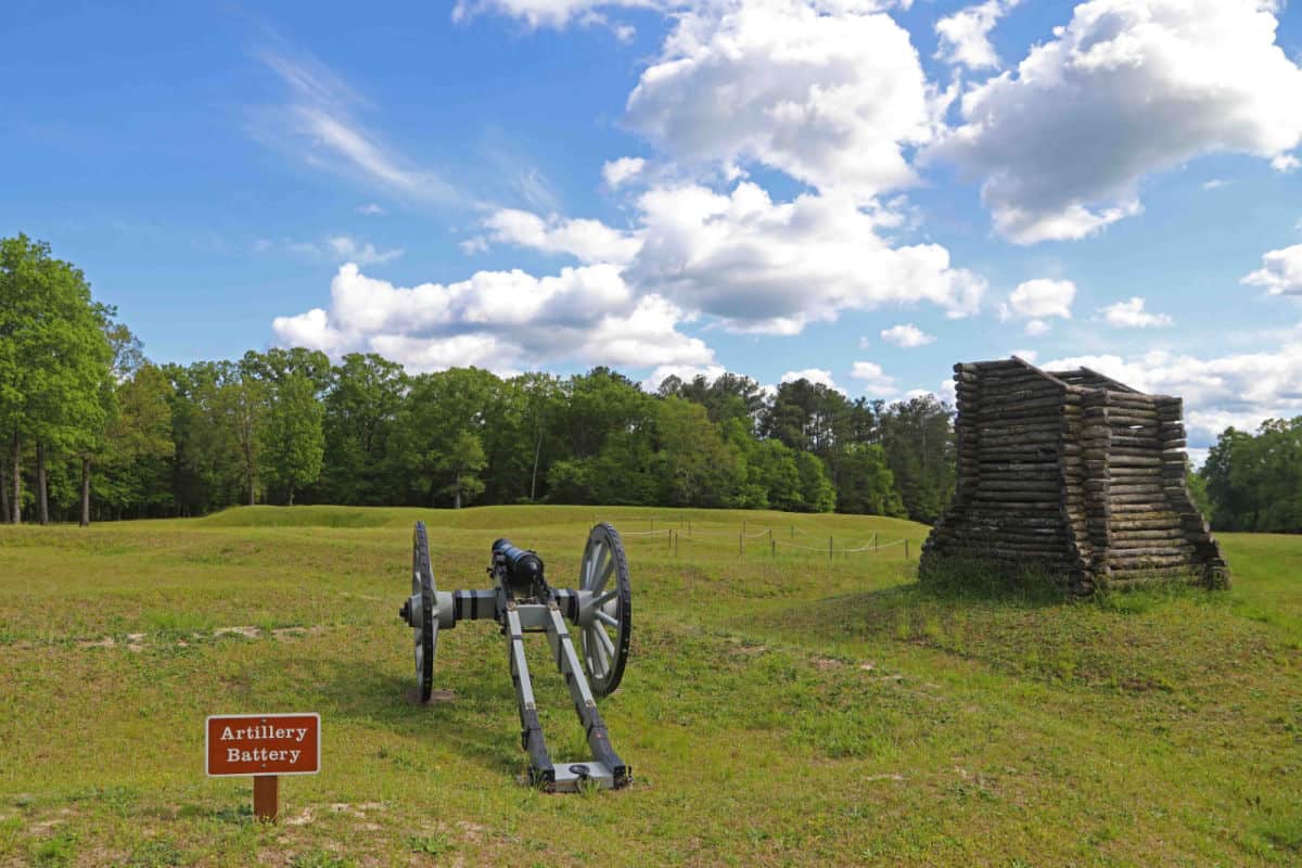 Artillery Battery sign near a cannon and wooden fort