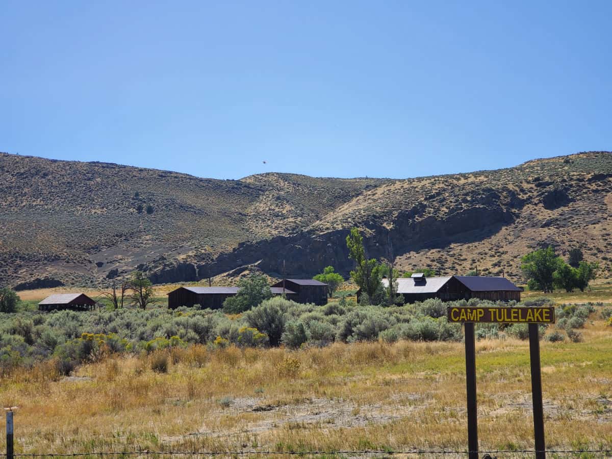 Camp Tulelake building behind a sign designating Camp Tulelake