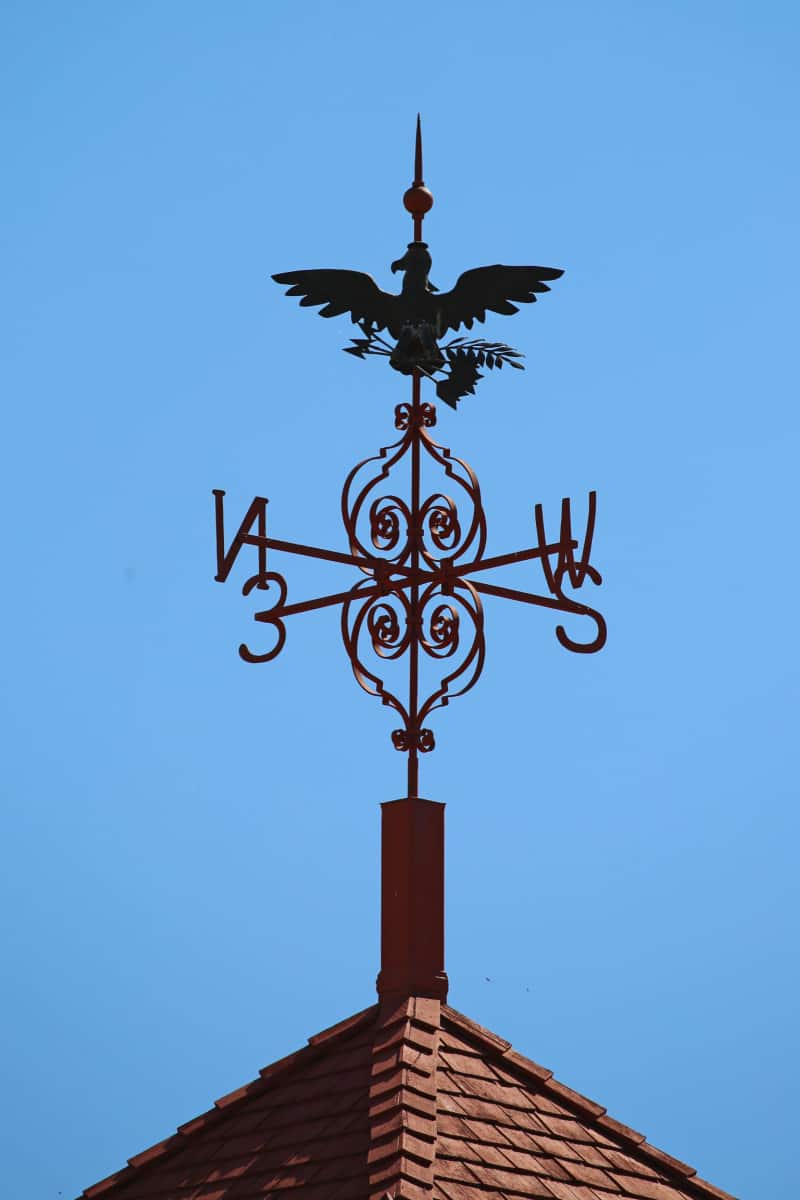 Eagle weathervane on a red roof