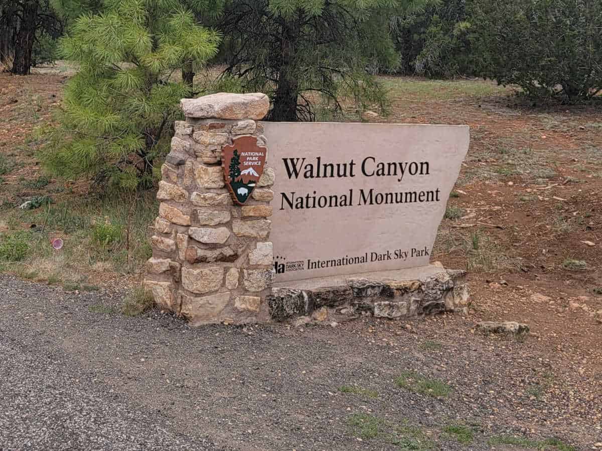 Walnut Canyon National Monument Entrance Sign with national park service emblem
