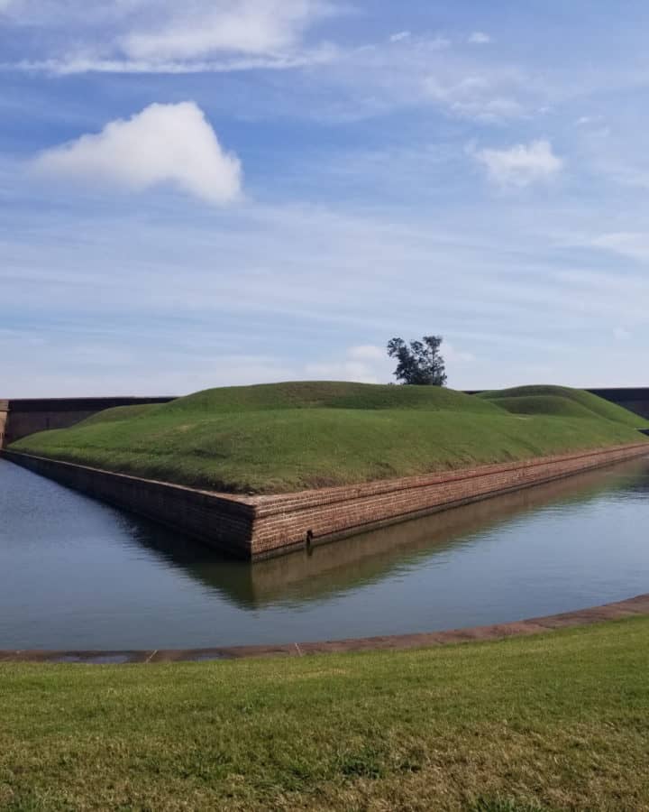 Water in the moat surrounding Fort Pulaski on a sunny day