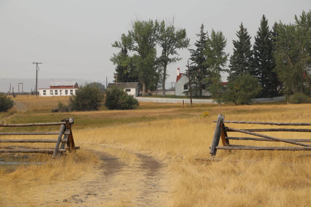 Ranch fence and road to historic buildings
